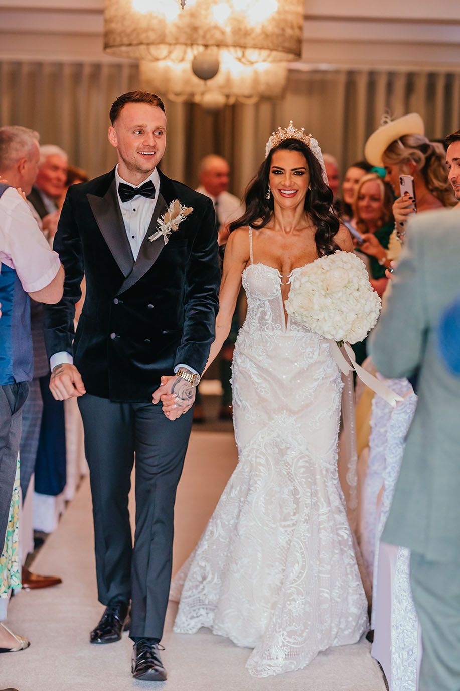 Bride and groom walking down aisle in Connemara Suite