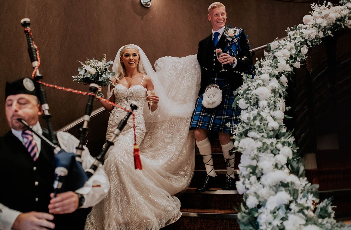 Bride and groom on Salerno Suite stairs