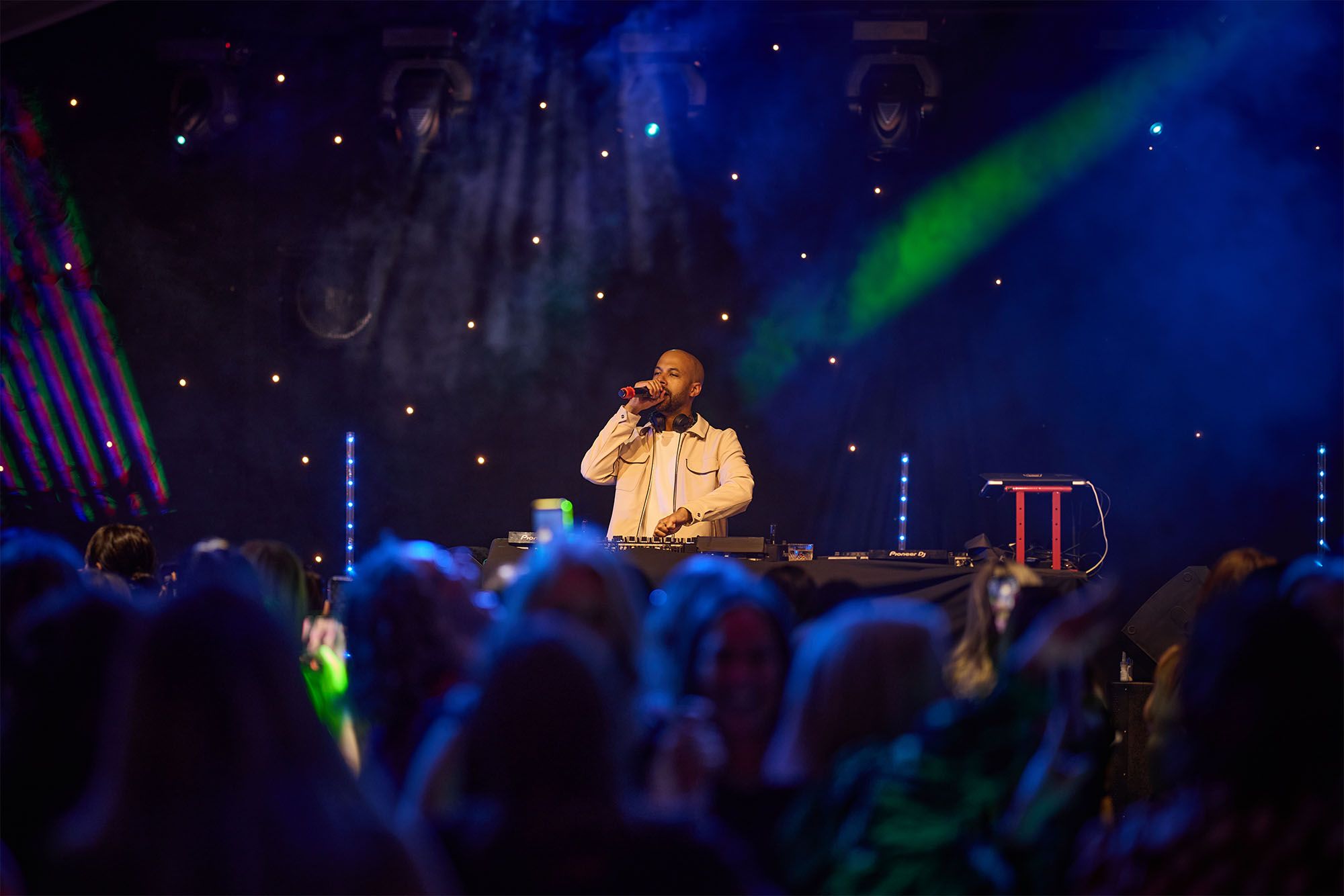 DJ Marvin Humes in front of large crowd