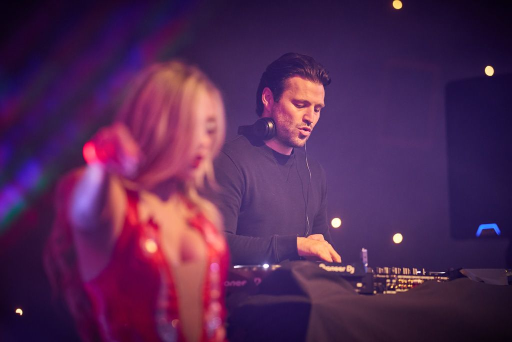 Mark Wright on the decks with girl dancing