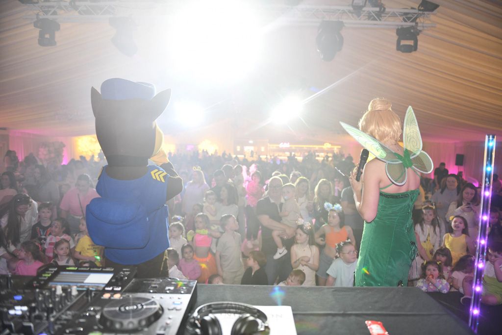 Tinkerbell facing the children