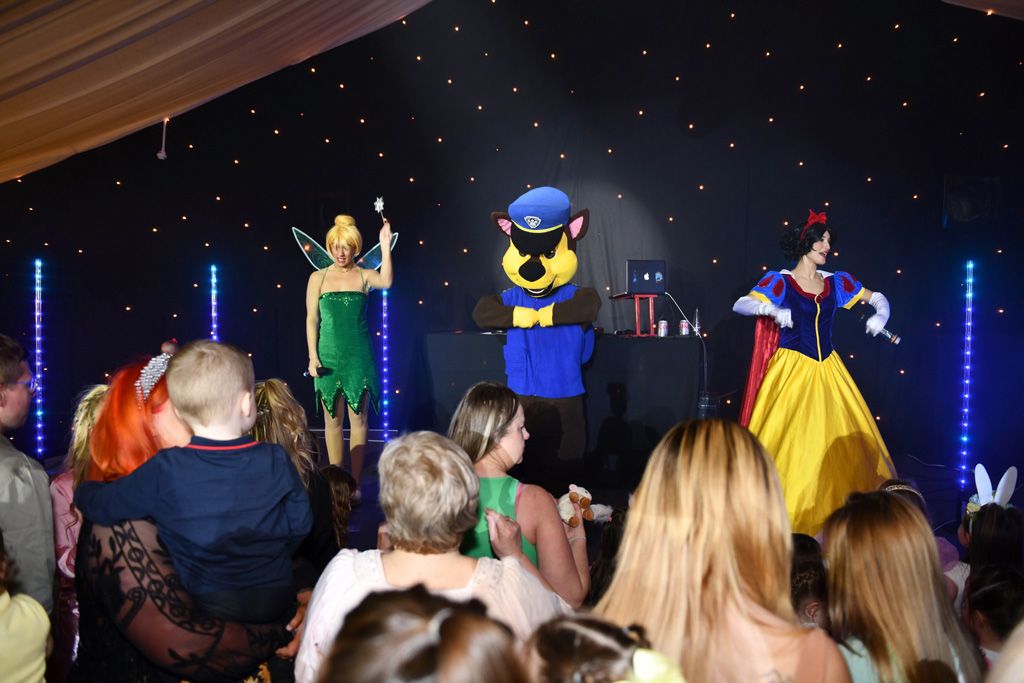 Disney princesses and cartoon characters on stage