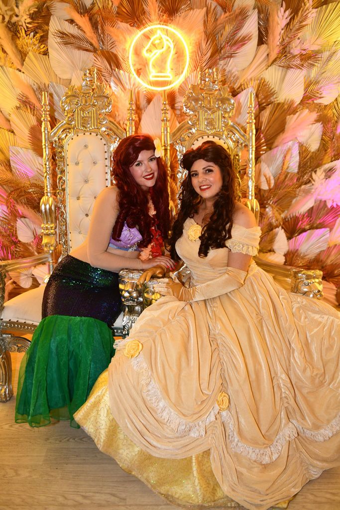 Lilo and friend smiling on thrones