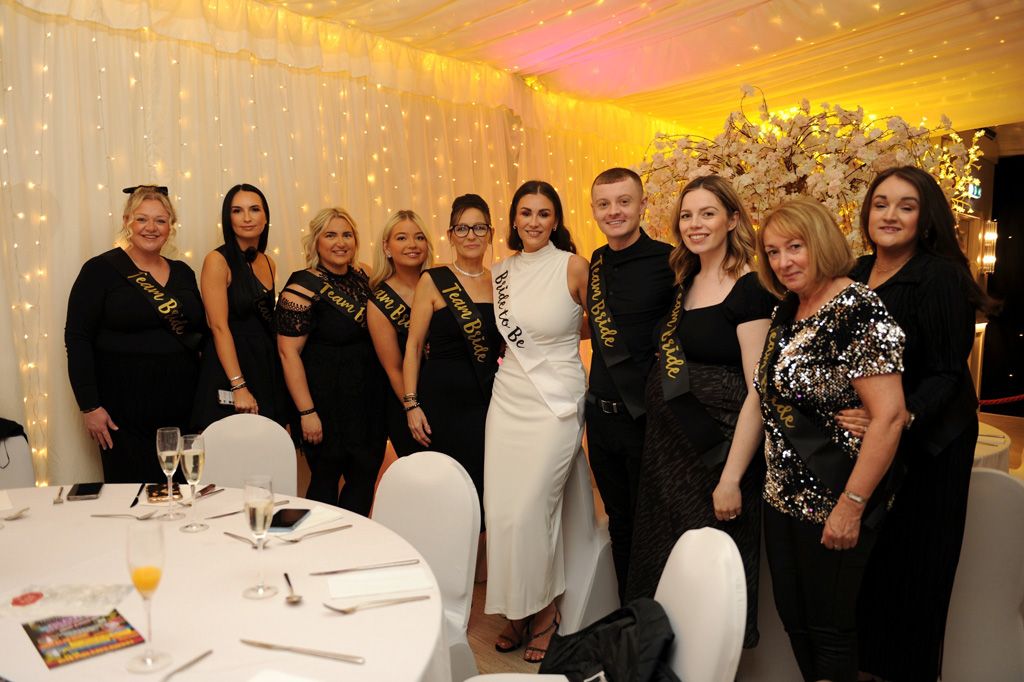 Large group posing in Grand Marquee