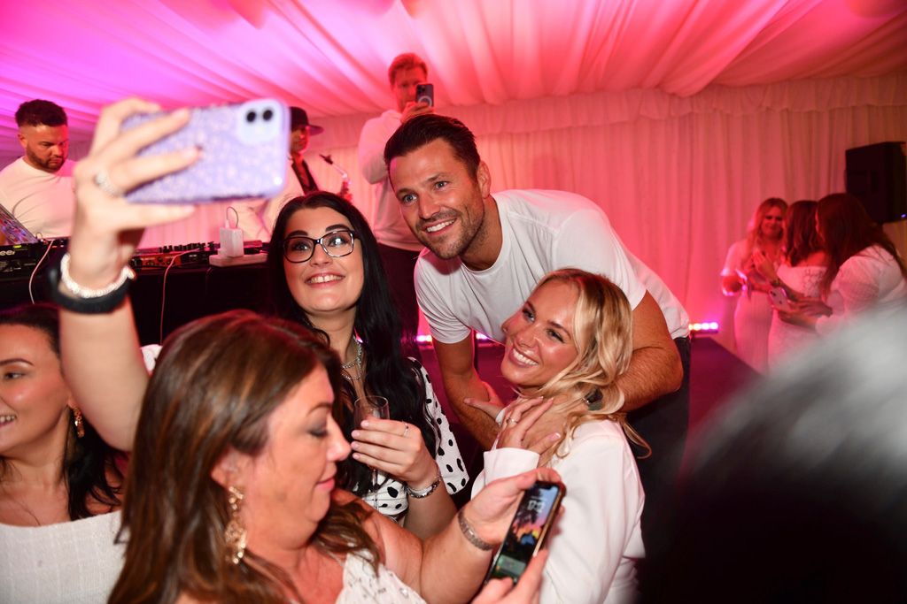 Two girls taking selfie with Mark Wright