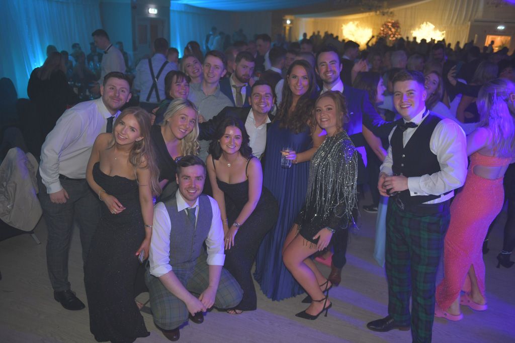 Large group posing on dance floor