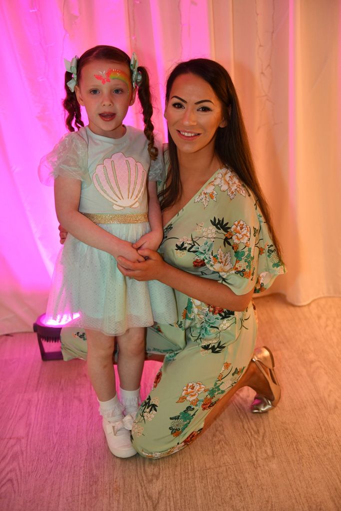 Mum and little girl in matching pale green
