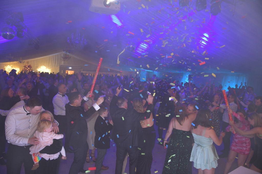 Scottish ceilidh celebrating with confetti in the air