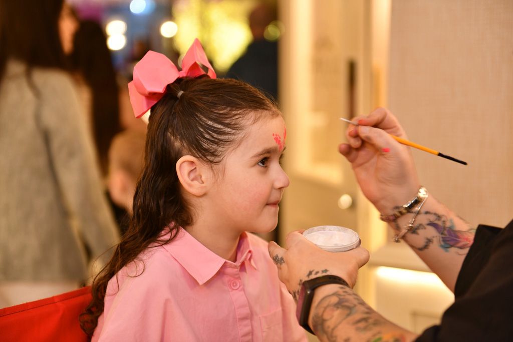 Girl getting her face painted
