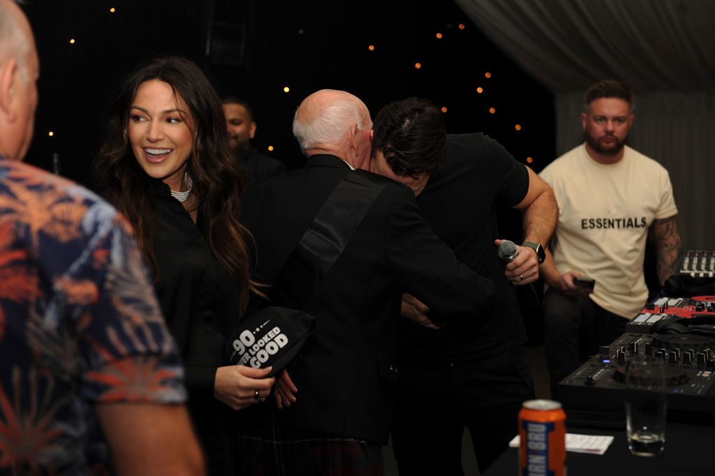 Michelle Keegan laughing with family