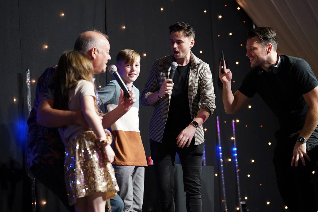 Mark Wright on stage with family