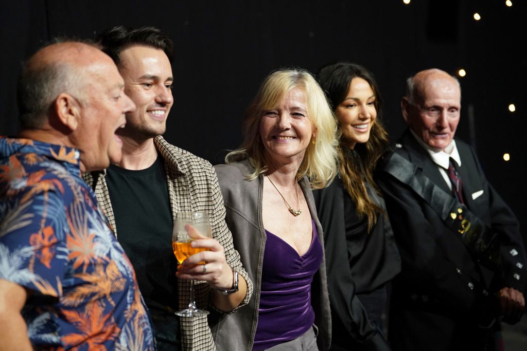 Michelle Keegan on stage with family