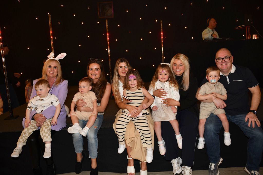 Parents with young kids posing