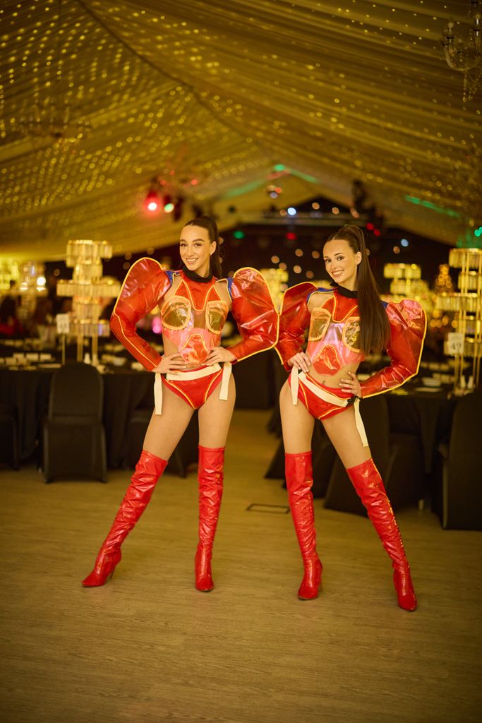 Ingliston cabaret dancers dressed in red