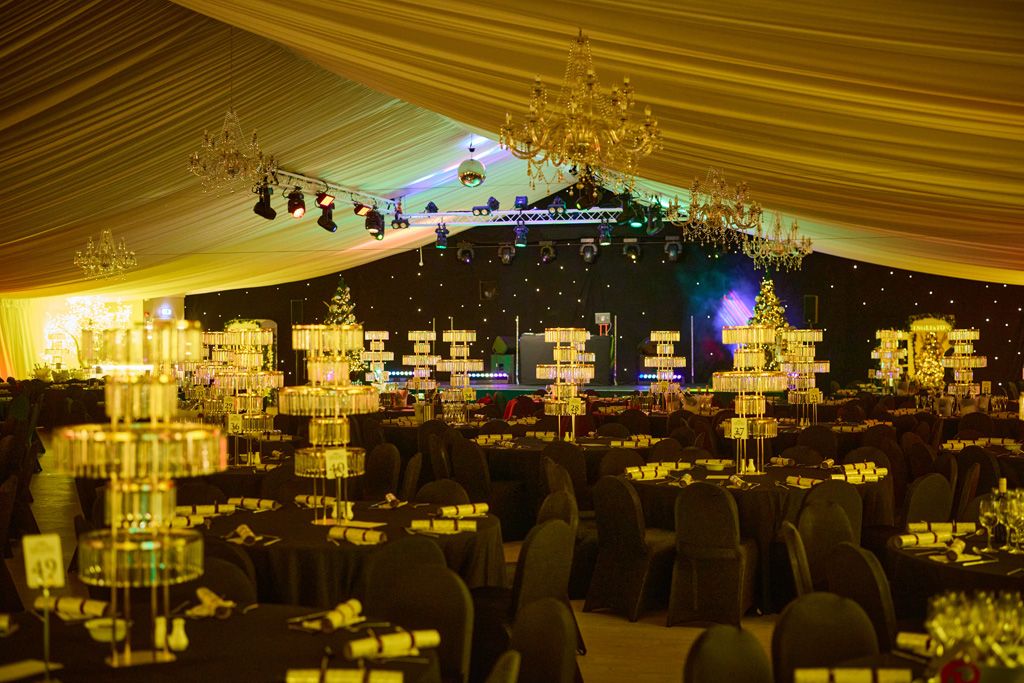 Festive table setup in grand marquee