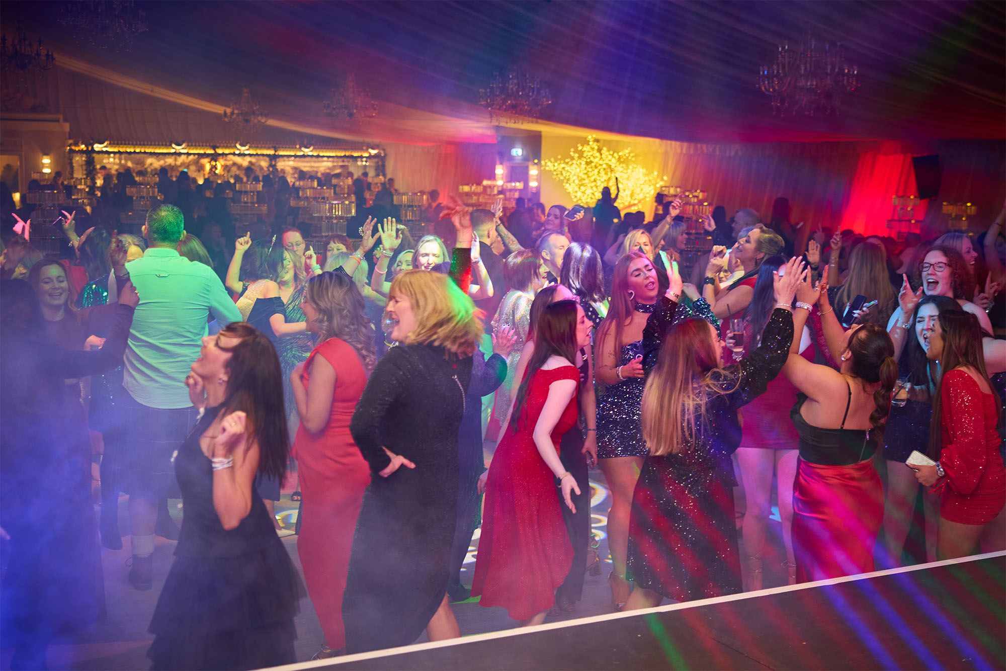 Crowd in festive clothing dancing